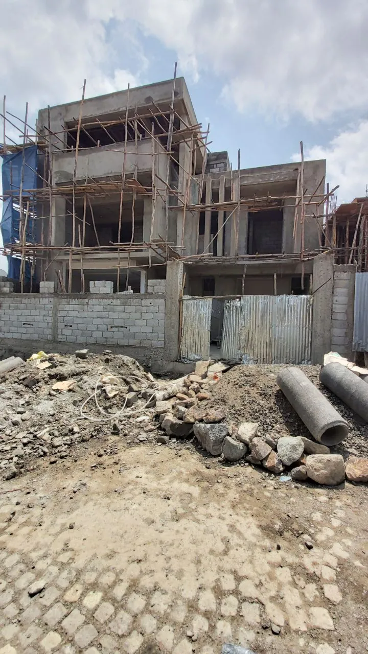 The villa's concrete frame and blockwork during construction